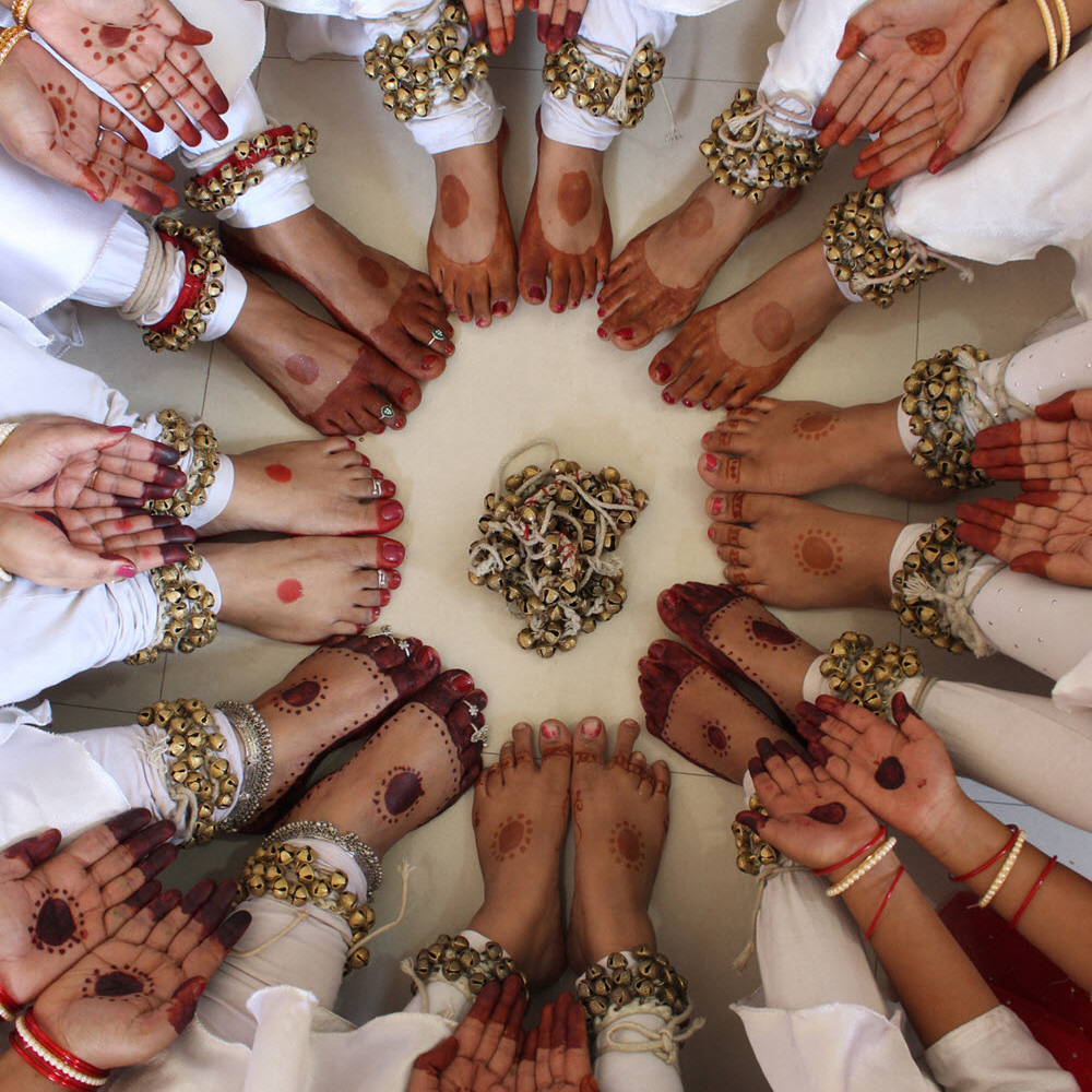 kathak dancers with ghungroos in a circle